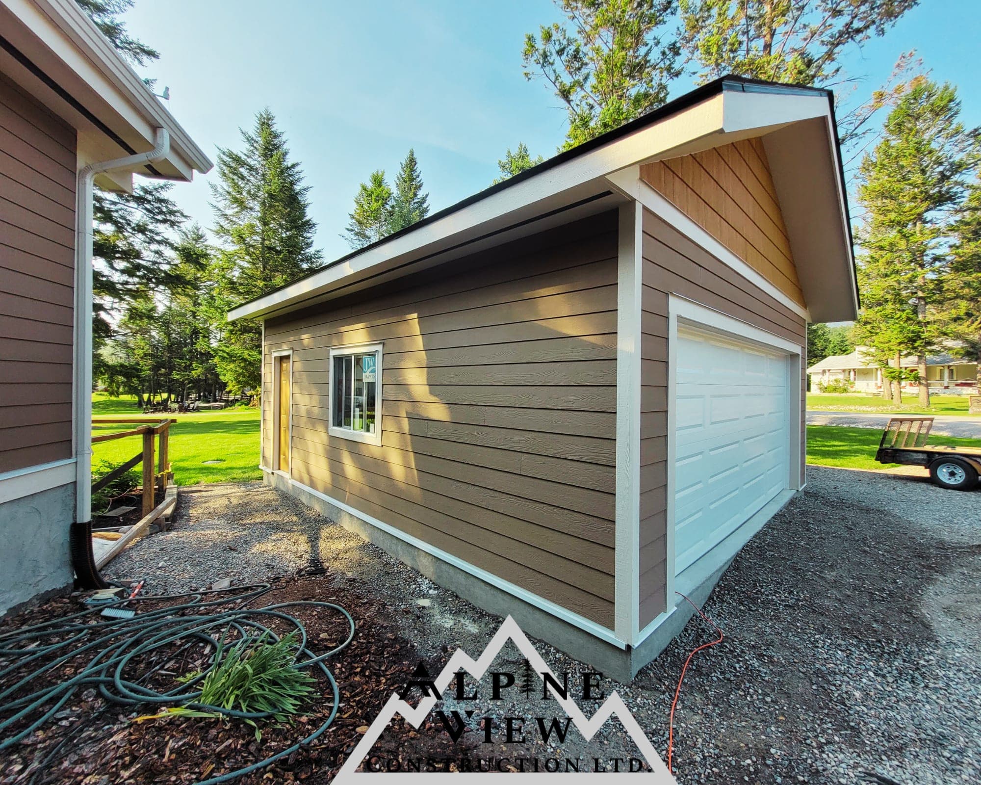 Custom-built detached garage with cedar siding
