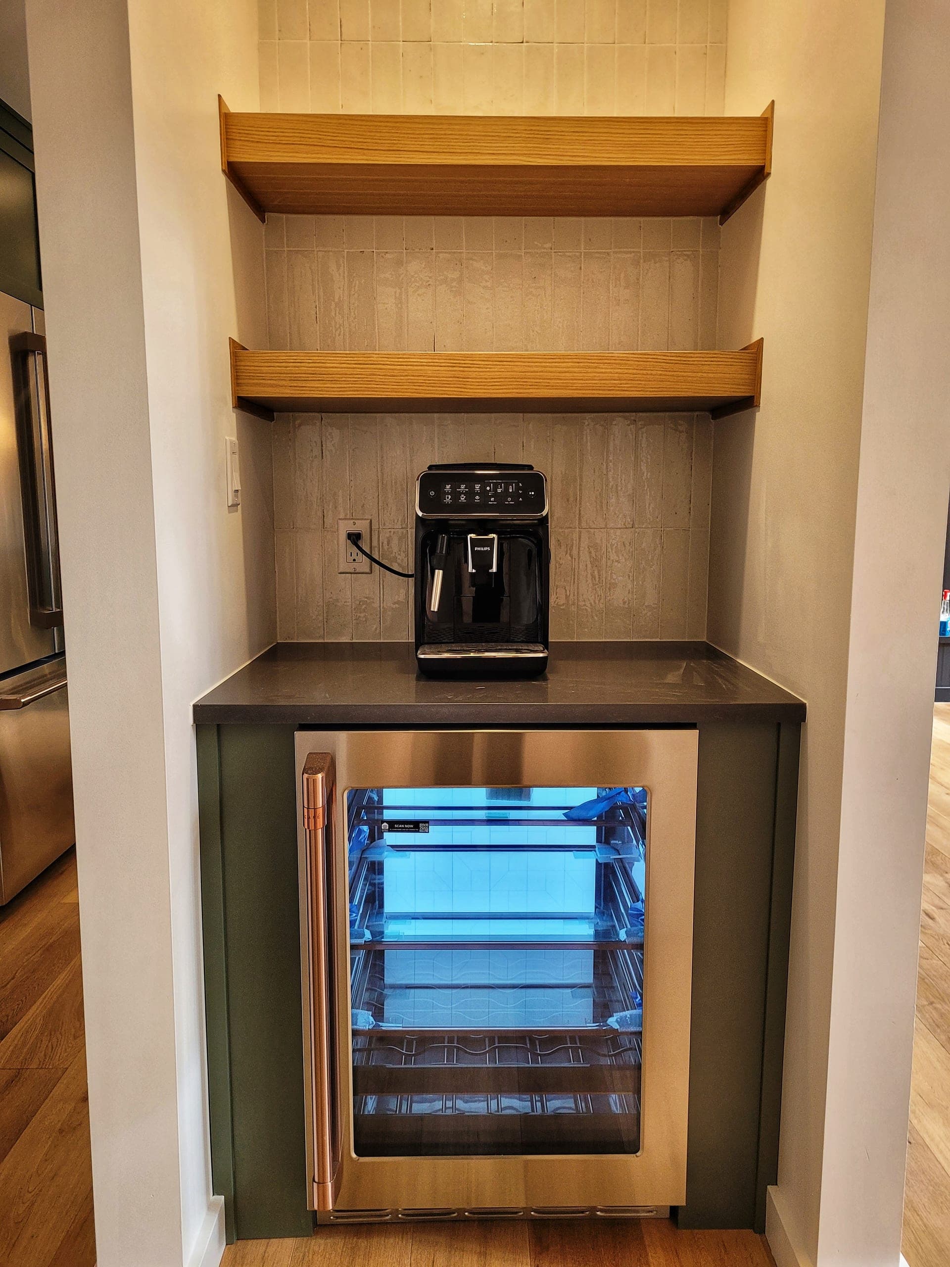 Custom built-in coffee bar with beverage fridge and floating shelves
