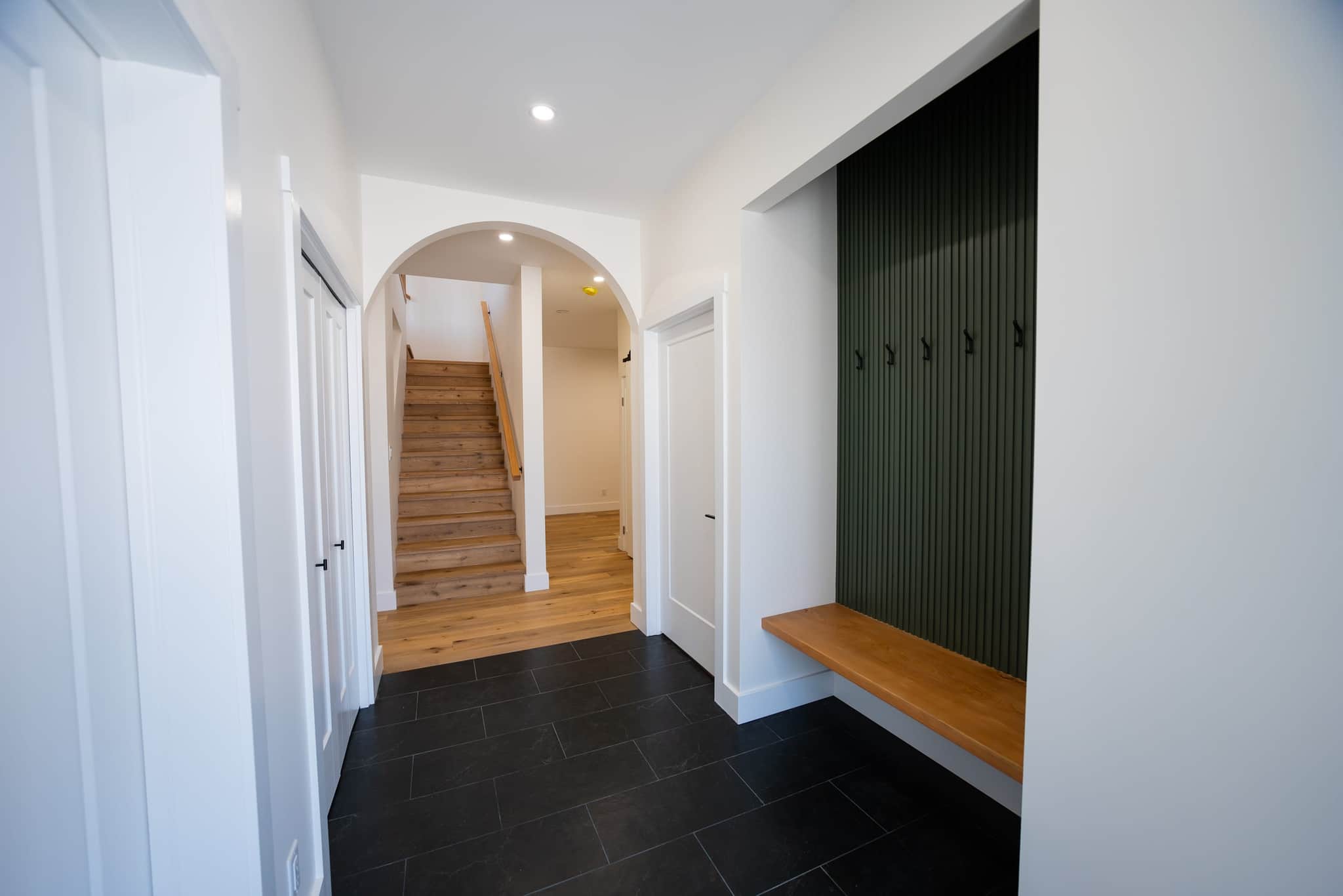 Custom entryway with arched opening — Alpine View craftsmanship