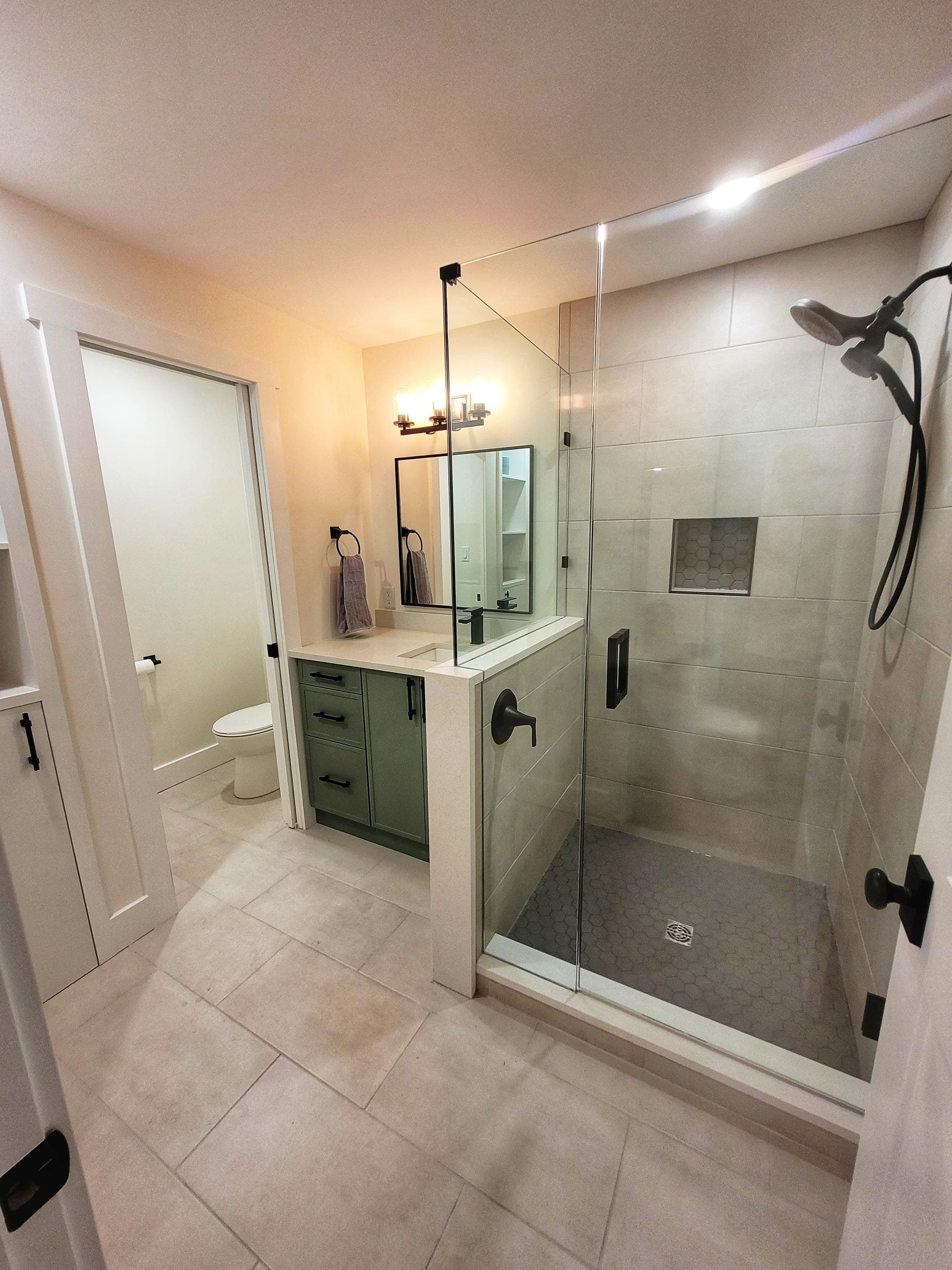 Cottage bathroom renovation with sage vanity and tile shower — blog cover
